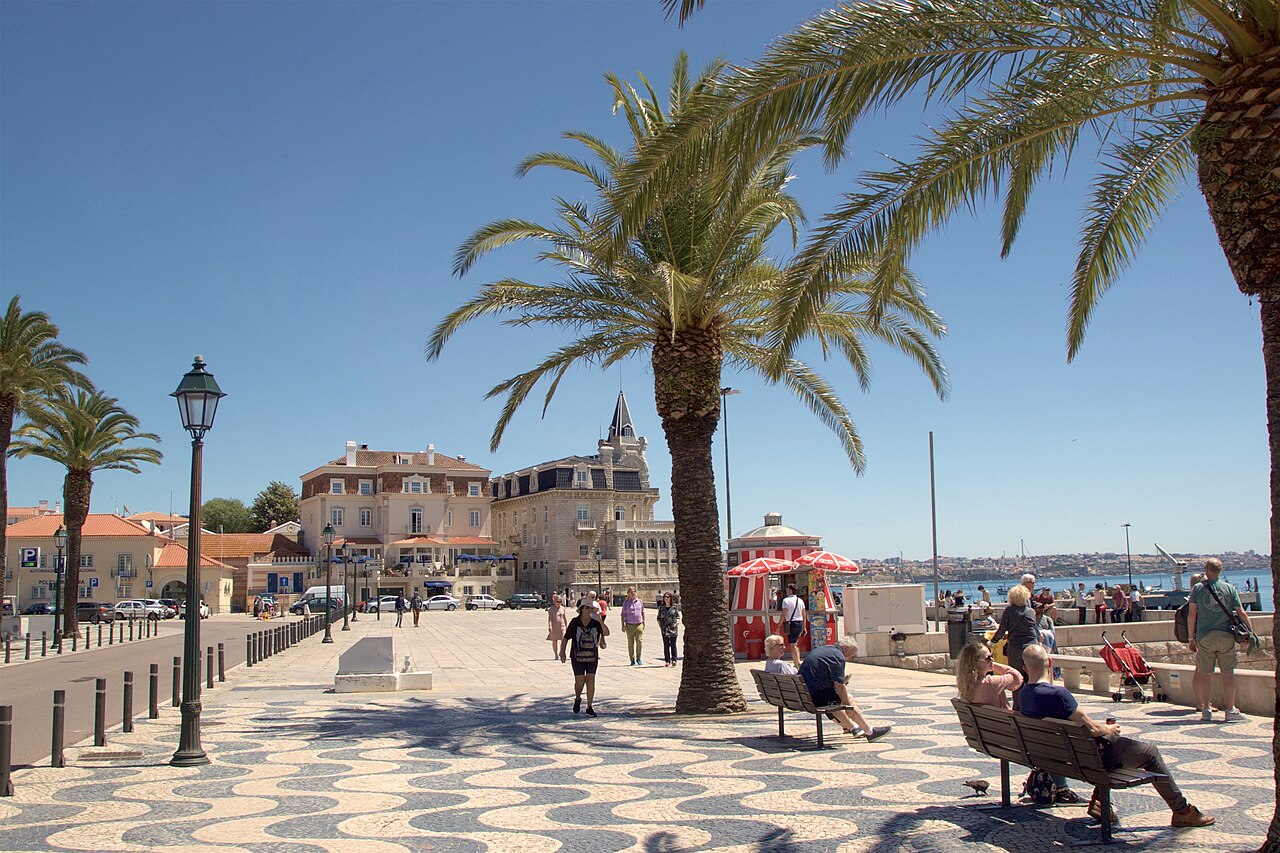 Cascais waterfront with palm trees and mosaic pavement